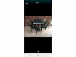 Cast iron table and chairs - Image 1